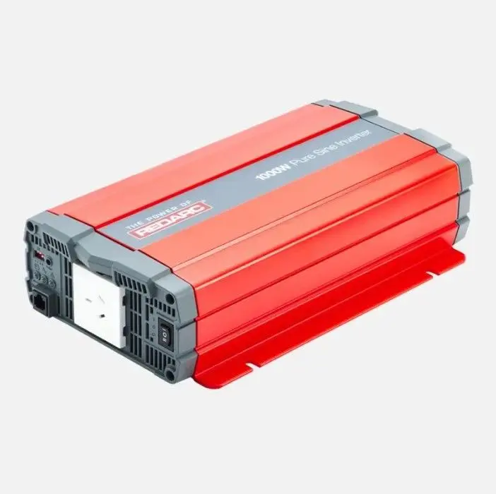 A red and gray power inverter is plugged in.