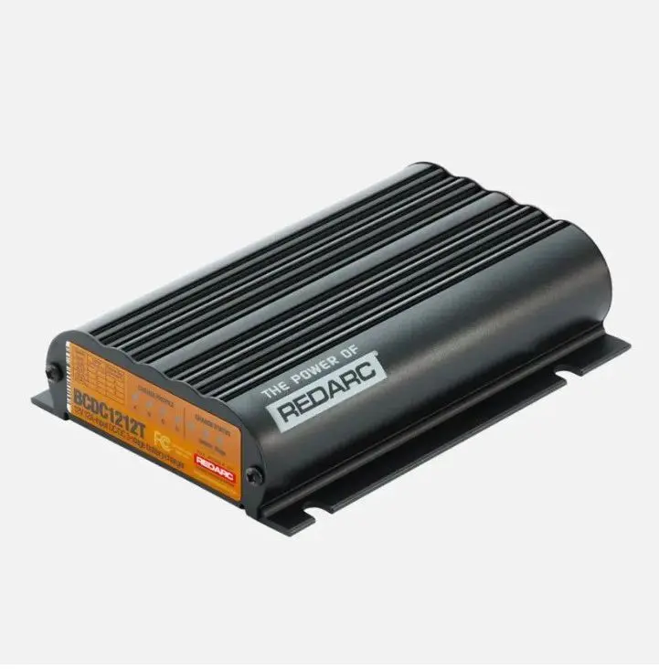 A black box with an orange label on top of it.