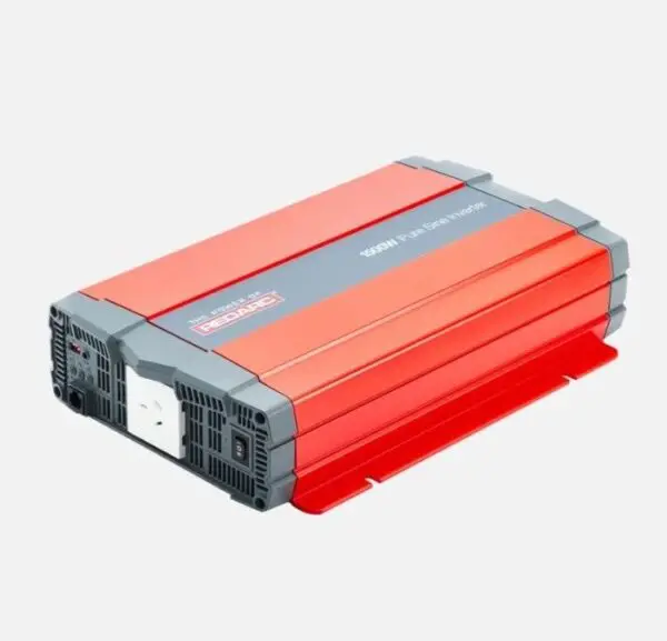 A red and gray power inverter is on the ground