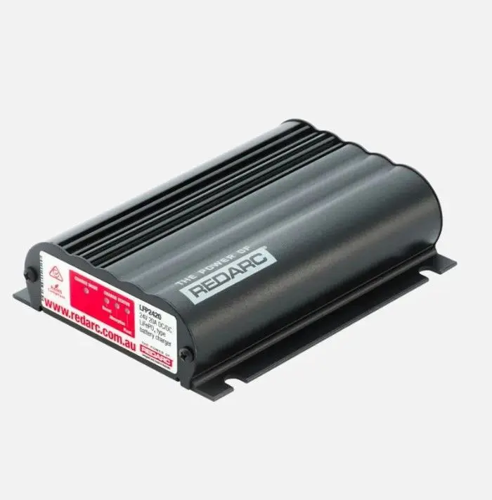 A black box with red label on top of it.
