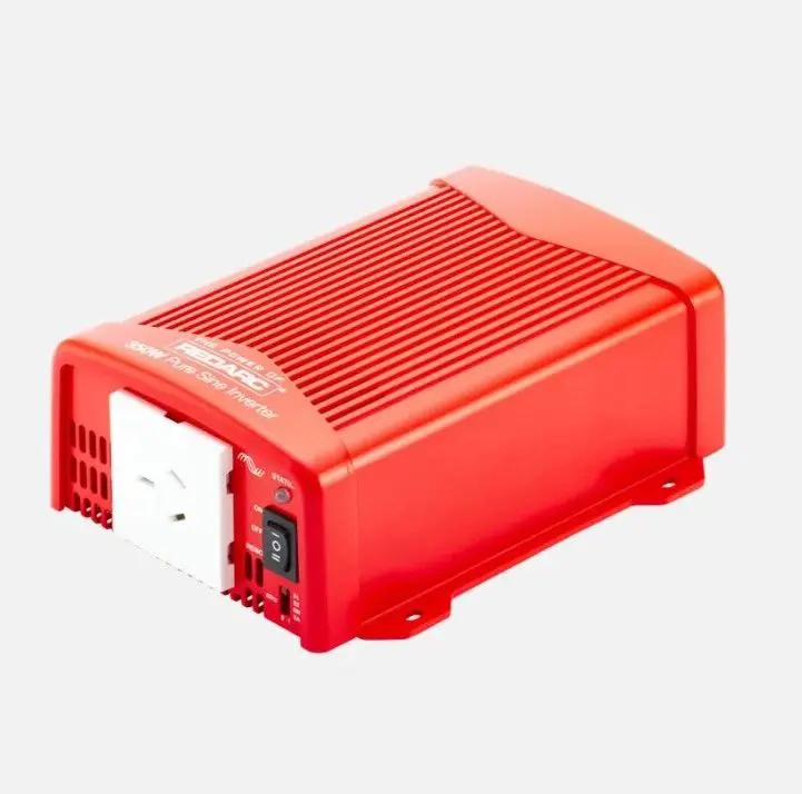 A red box with an electrical device on top of it.