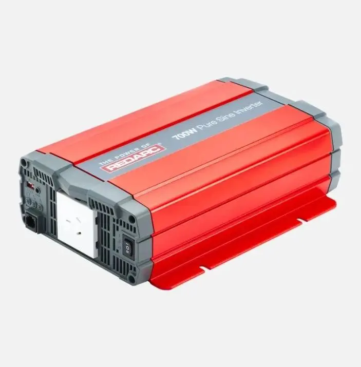 A red and gray power inverter is plugged in.