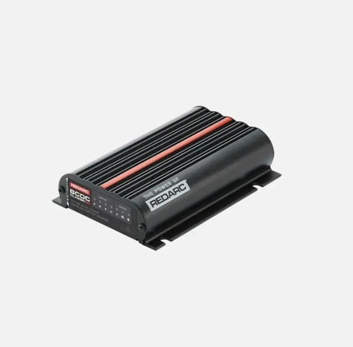 A black and red device is on the ground