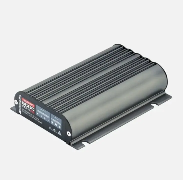 A silver and black device is on the ground