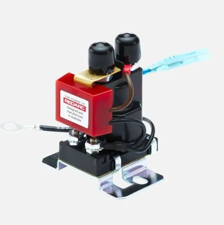 A red and black machine with wires attached to it.
