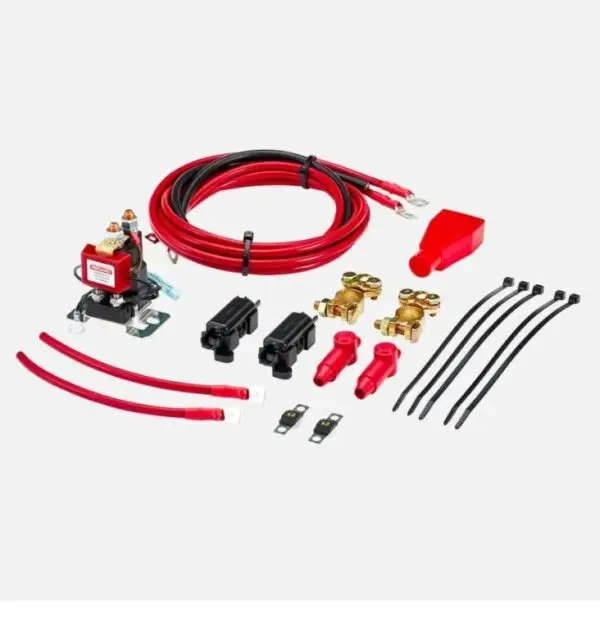 A red and black kit with wires, plugs, and a switch.
