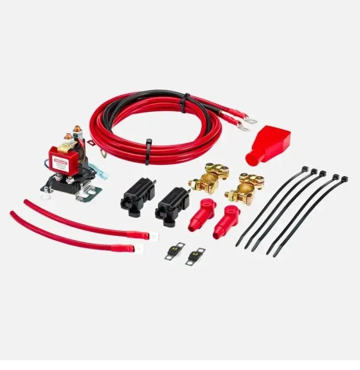 A red and black kit with wires, plugs, and a switch.