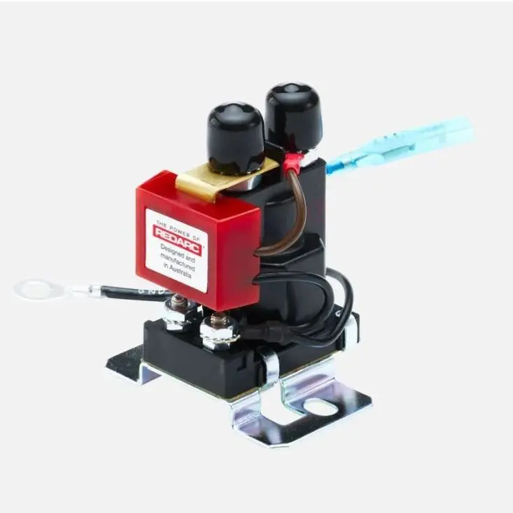 A red and black machine with wires attached to it.