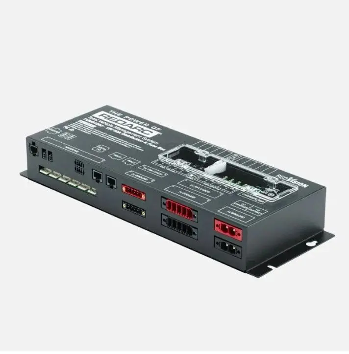 A black box with some red buttons and wires