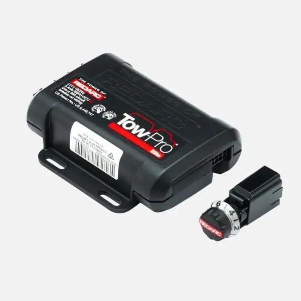 A black box with a red button and a black cover