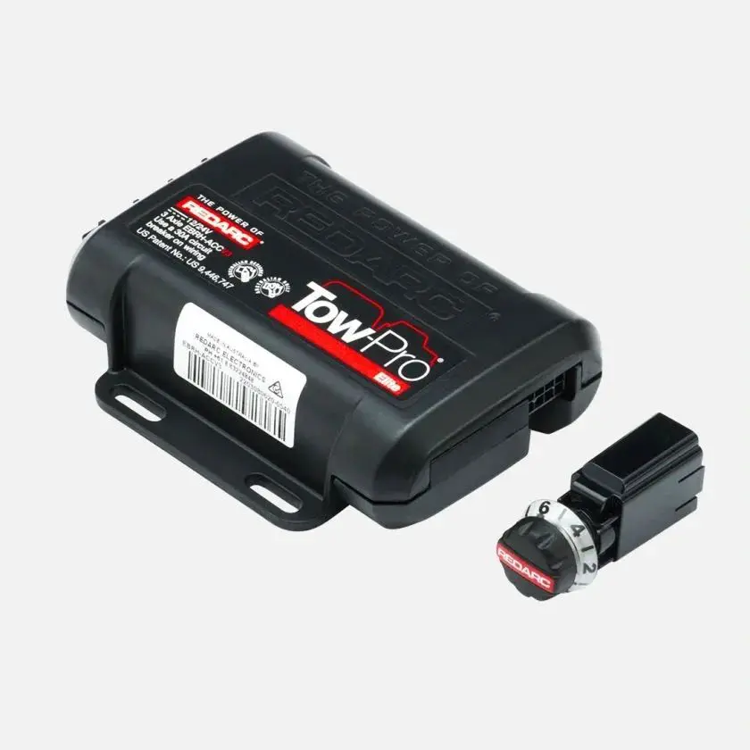 A black box with a red button and a black cover