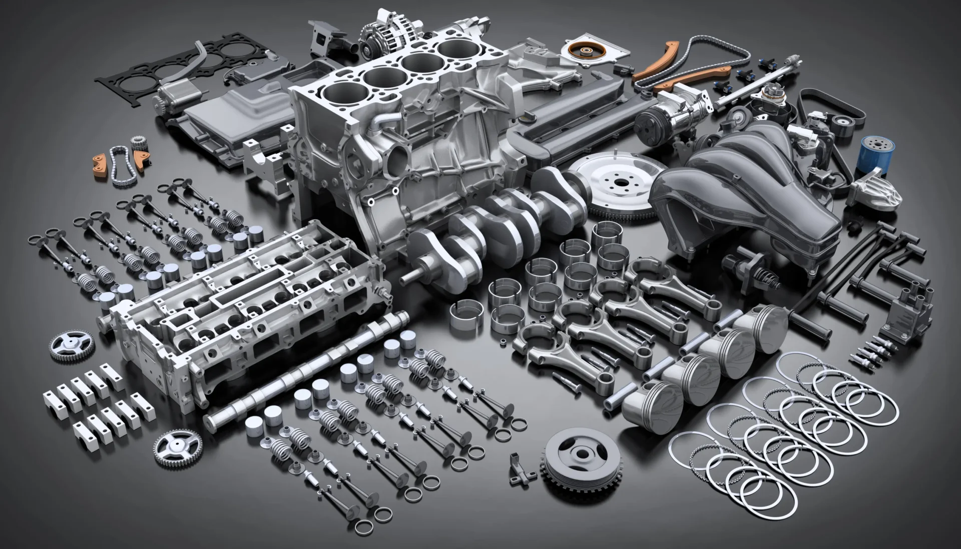 A table with many different parts of an engine.