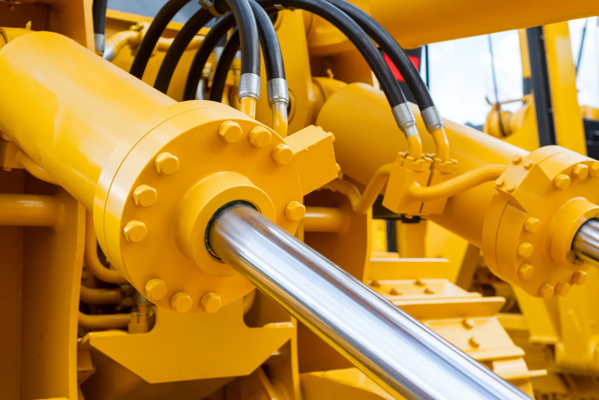 A close up of the side of a yellow machine.